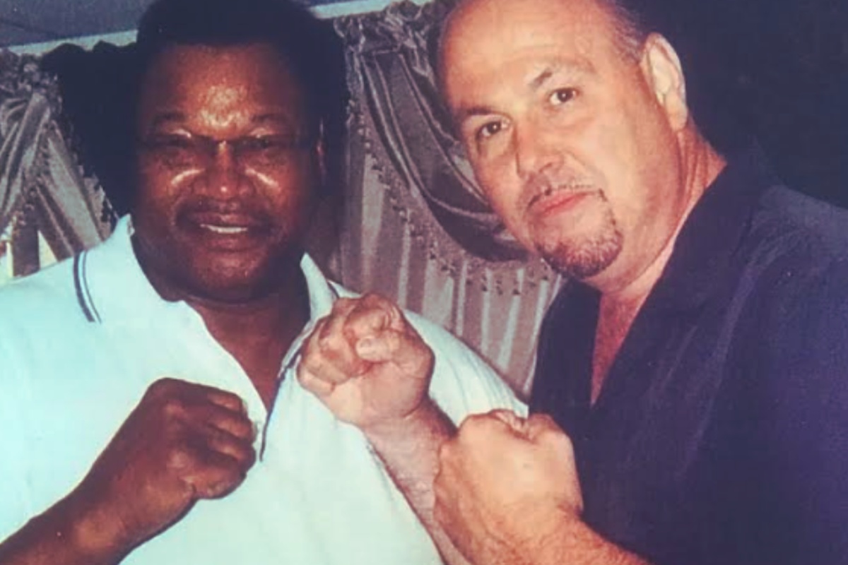 jay dehmalo and george foreman posing boxing - 1200x800
